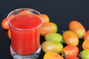 Fresh tomatoes and juice