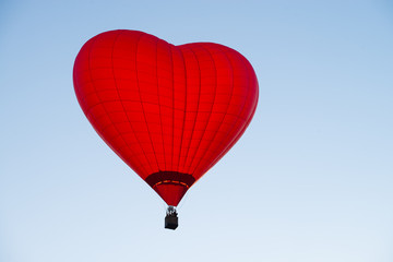 balloon in the form of heart against a blue sky