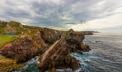 Monument on the rocks by the sea of Philippe Cousteau, Gijon, Spain