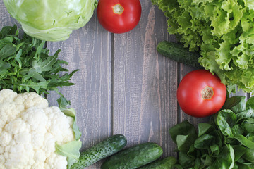 Composition of vegetables on grey wooden desk.