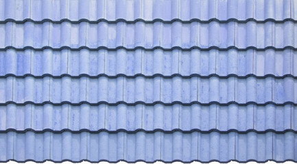 Close up of bright light blue tile roof surface, abstract background texture