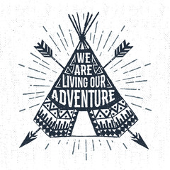 Hand drawn tribal label with textured teepee vector illustration and "We are living our adventure" inspirational lettering. © SlothAstronaut