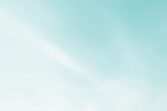 Blue clouds sky heaven background. Soft focus pastel sky white sunlight day time background. Abstract blurred of sunlight. Open view out windows. Cyan gradient cool backdrop. Blurry nature 