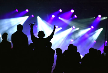 Obraz premium Stage lights. Concert scene with crowd in foreground