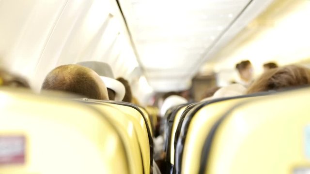 Interior of airplane with passengers on seats