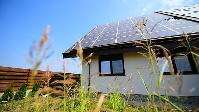 Renewable energy home solar and thermal energy panels on roof