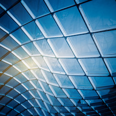 glass sunshade structure,blue toned image.