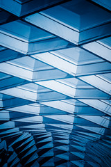 glass sunshade structure,blue toned image.