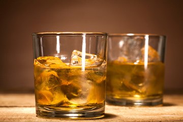 Whiskey on wooden background