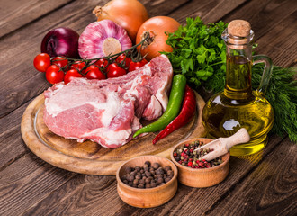 Raw marbled meat steak Ribeye on dark wooden background