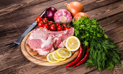 Raw marbled meat steak Ribeye on dark wooden background