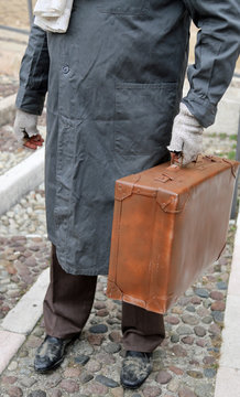 immigrated with old leather suitcase
