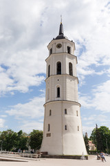 Fototapeta na wymiar Vilnius, Lithuania. The Bell Tower beside St. Stanislaus Cathedral in Vilnius, Lithuania. The Bell Tower, one of the oldest and tallest towers of the Old Town.