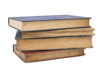 A pile of old hardback story books isolated on a white background