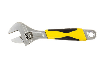 Closeup of adjustable wrench with yellow and black handle isolated on a white background. Tools series.