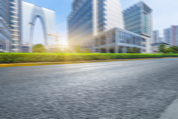 clean asphalt road with city skyline background,china.
