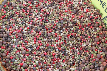 Mixed black, red, white and green pepper on a market
