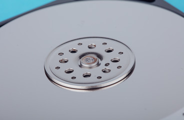 real open computer hard drive on a blue background