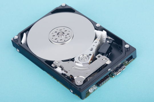 real open computer hard drive on a blue background