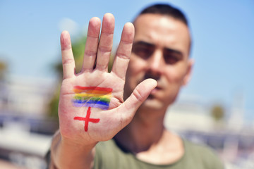 rainbow flag and plus sign, for LGBTI HIV-positive people