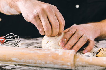 Hands kneading a dough