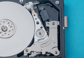 real open computer hard drive on a blue background