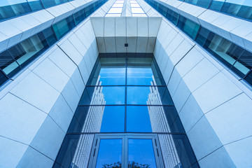 Obraz premium modern office building,blue toned image,china.