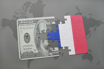 puzzle with the national flag of france and dollar banknote on a world map background.