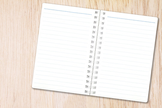 Open notebook paper with line on nature wood background for design with copy space for text or image.