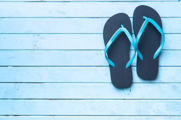 Blue flip flops.