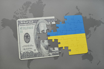 puzzle with the national flag of ukraine and dollar banknote on a world map background.