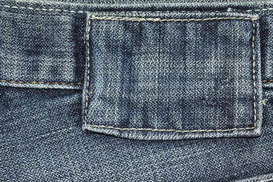 Denim jeans texture or denim jeans background with label of fashion jeans design with copy space for text or image.