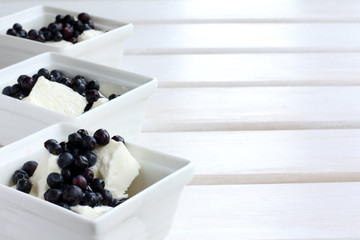 cool sweet dessert with berries/ ice cream with pieces of natural blueberry 