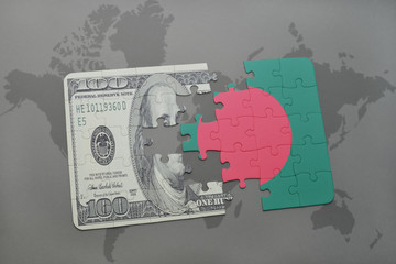 puzzle with the national flag of bangladesh and dollar banknote on a world map background.