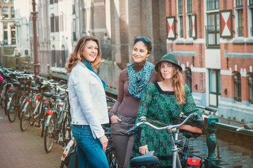 Tourists with bicycles in Amsterdam