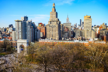 New York, New York, USA skyline of Greenwich Village over Washington Square Park.