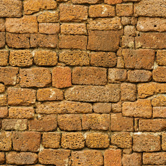 Seamless pattern - old brown rough natural stone wall