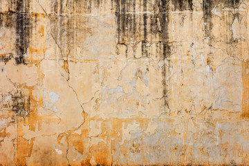 Old concrete wall with peels off paint