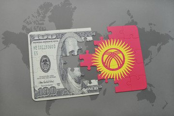 puzzle with the national flag of kyrgyzstan and dollar banknote on a world map background.