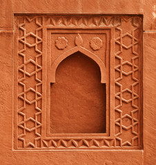 Decorative element - window on wall of an ancient palace. India,