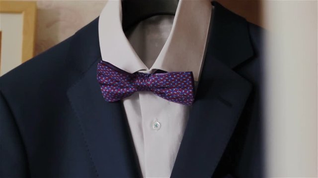 Men's blazer with bow tie.