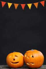 jack o'lanterns and chalkboard background with autumnal bunting