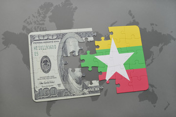 puzzle with the national flag of myanmar and dollar banknote on a world map background.