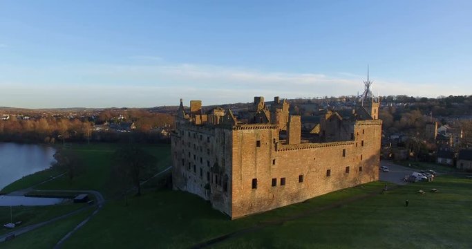 Aerial: Linlithgow Palace beside Linlithgow Loch, Scotland