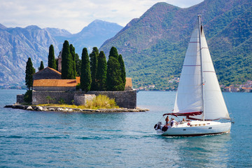 St.George Island in Montenegro and sailing yacht - obrazy, fototapety, plakaty