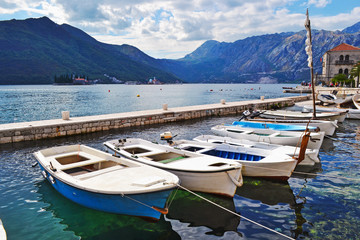 Fototapeta na wymiar Harbor and boats at Boka Kotor bay, Montenegro