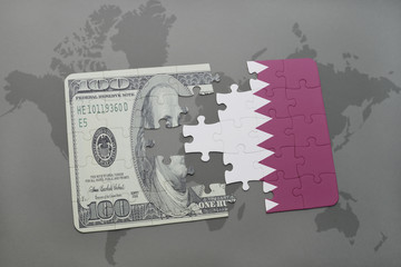 puzzle with the national flag of qatar and dollar banknote on a world map background.