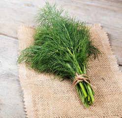 Fresh dill on an wooden surface