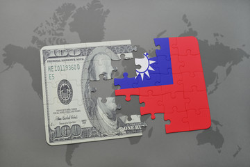 puzzle with the national flag of taiwan and dollar banknote on a world map background.