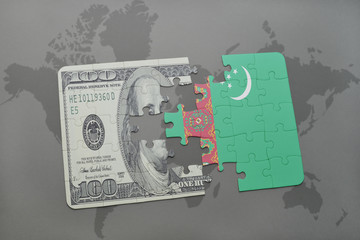 puzzle with the national flag of turkmenistan and dollar banknote on a world map background.